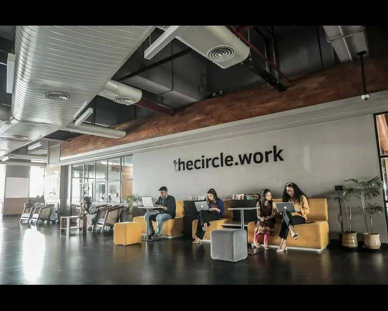 thecircle.work at Huda City Centre Metro Station lobby with yellow sofas and industrial ceilings