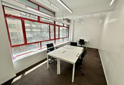 Private four-person office suite with bright red window frames.