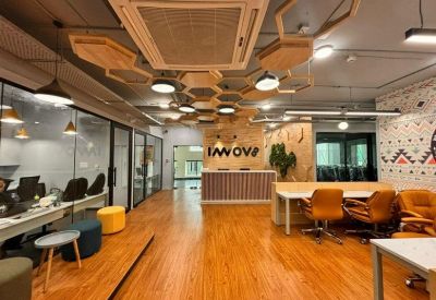 Reception area featuring a wood-panelled desk and branded signage.