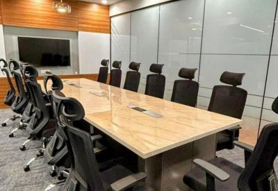 Large formal conference room featuring a marble-topped table and modern globe pendant lighting.