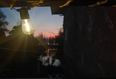 Exterior sunset view with a glowing decorative bulb overlooking the 2F 641 building area.