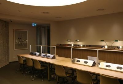 Quiet workspace with individual study lamps and chairs