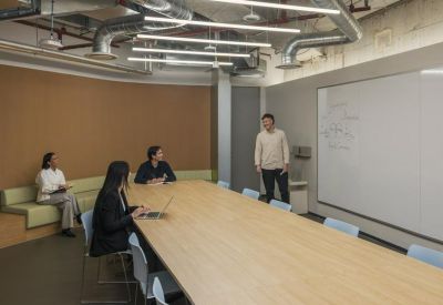 Meeting room with a long table and whiteboard