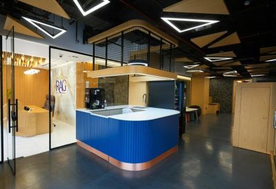 Communal kitchen area with a central coffee station.