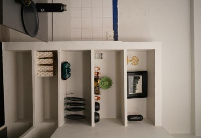 Kitchen area with shelves and a small counter space.