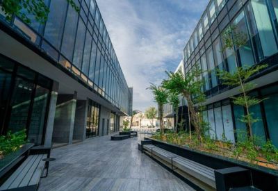 Outdoor communal area with benches and plants.