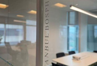 Glass door leading into a meeting room with the name Istanbul Bosphorus etched on the pane.