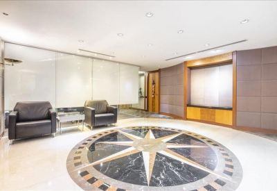 Bright reception area featuring a polished floor with a large marble star inlay design.