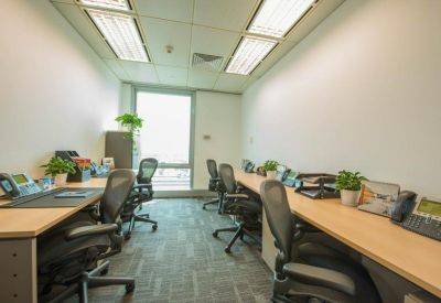 Narrow private office suite with ergonomic chairs and light wood desks.