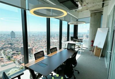 Meeting room with panoramic city views and a large dark conference table.