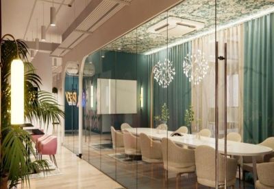Meeting room with elegant chairs and decorative ceiling.