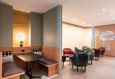 Cozy dining booth and lounge area with warm wood paneling.