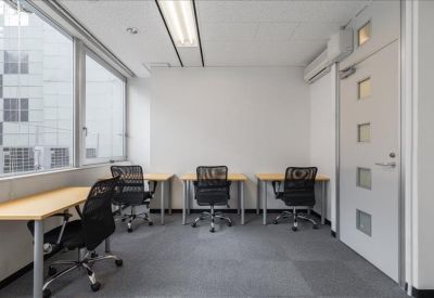 Private office space with individual desks and large windows.