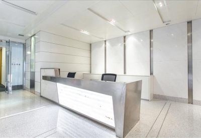 Modern minimalist reception desk with a white and metallic finish.
