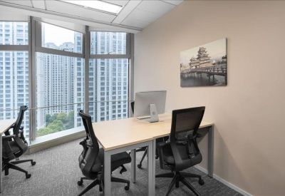 Bright two-person private office featuring a large window with expansive city views.