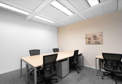 Spacious internal conference room with a large wooden table and ergonomic chairs.