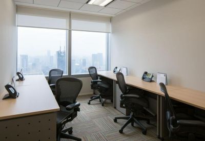 A multi-person office suite with ergonomic chairs and views overlooking the Shanghai skyline.