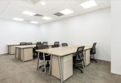 Sleek reception area featuring a geometric copper-toned front desk and wooden flooring.