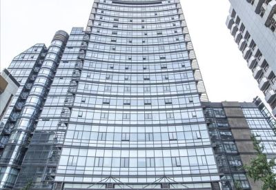 Exterior of the glass Plaza of Zhejing Foreign Economics and Trade with modern architectural curves.