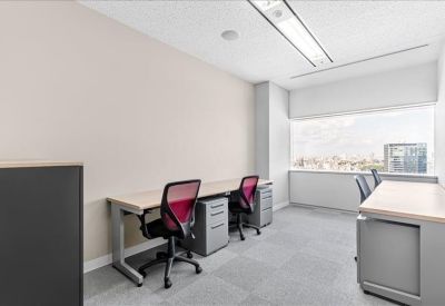 Two-person private office suite with ergonomic red chairs and a large window.