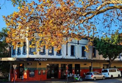 Exterior view of the Phoenix building at 1 Moncur Street, Woollahra with autumn trees.