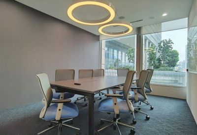 Bright conference room with circular pendant lights and floor-to-ceiling windows.