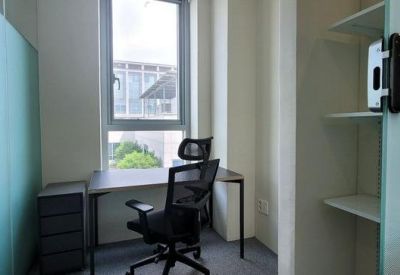 Small private office with a desk and ergonomic chair.