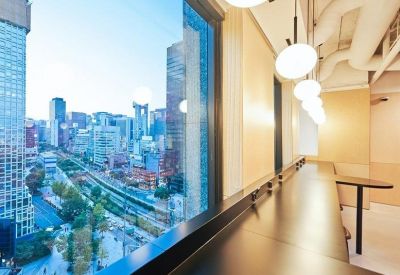 Window-side bar seating offering an expansive view of the Seoul city skyline.