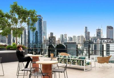 Outdoor rooftop terrace with city views and lounge seating.