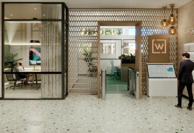 Modern reception lobby with light stone flooring and a stylish decorative screen.