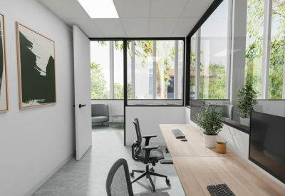 Private office suite with a long wooden desk and abstract wall art.