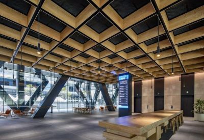 Grand lobby entrance with wooden coffered ceiling and built-in lighting.