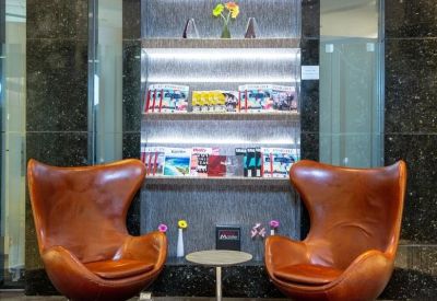 Plush leather chairs and a reading nook at Tower 2, Plaza 66, No. 1266, West Nanjing Road.