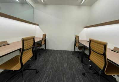 Modern reception area with a branded desk and integrated seating area.