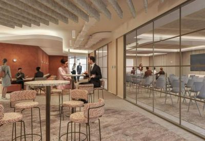 Meeting area with glass-partitioned boardrooms and high-top cafe seating.