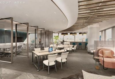 Modern coworking space with a variety of seating options including desks, lounge chairs, and meeting pods.