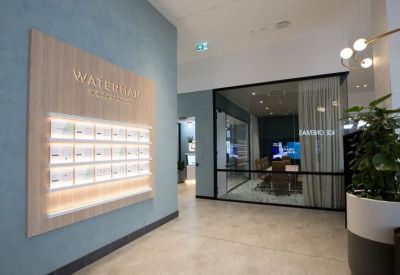 Modern reception area at 2107-2125, Dandenong Road, Clayton, Melbourne with wood feature wall and meeting room view.