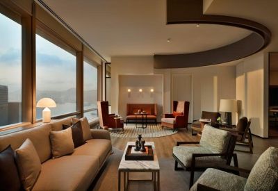 Spacious lounge area with plush sofas and panoramic mountain views.