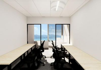 Private office suite featuring two rows of desks and glass partitions.