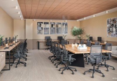 Large meeting room with a long wooden table, ergonomic chairs, and wall art.