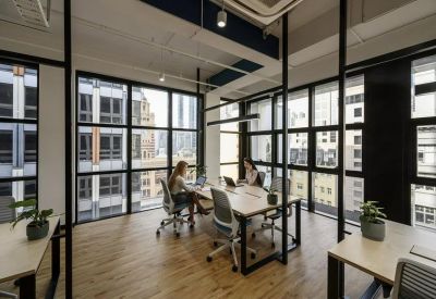 Modern glass-walled meeting room overlooking the city skyline.