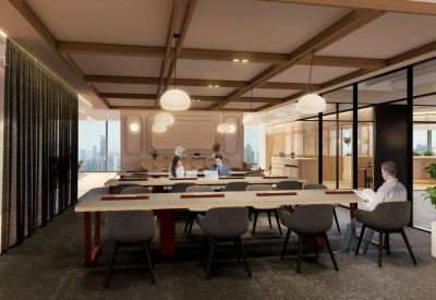 Quiet study or co-working zone with long communal tables and grey ergonomic chairs.