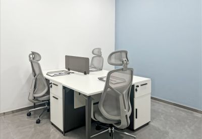 Four-desk workstation setup with integrated storage drawers and privacy dividers.