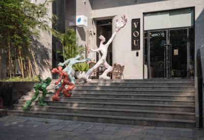Interior view with abstract sculptures and metal accents.