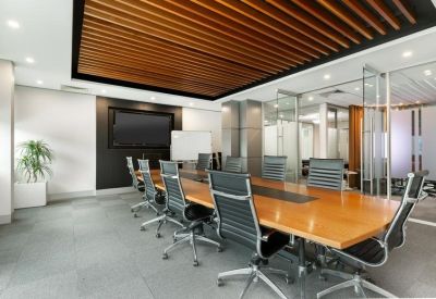 Spacious boardroom at 64, Victor Crescent, Level 1, Melbourne with wood-slat ceiling and large meeting table.