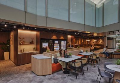 Bright pantry and dining area with high ceilings and booth seating.