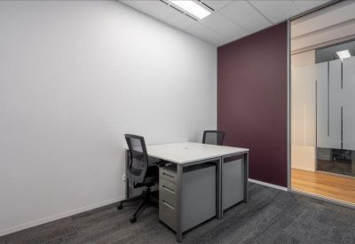 Internal private office for two with a deep purple feature wall.