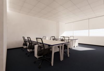 Bright multi-desk office suite with ergonomic chairs and large windows.