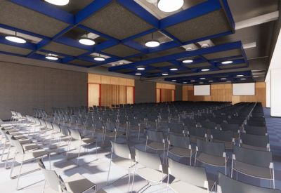 Large tiered auditorium with blue ceiling grid and rows of dark seating.