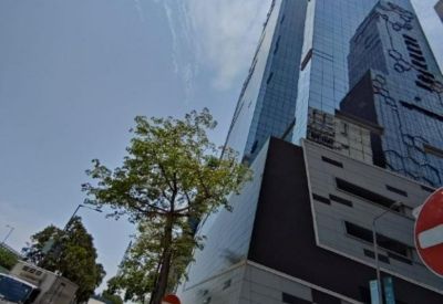 A low-angle view of the modern glass-facade skyscraper at King Palace Plaza.